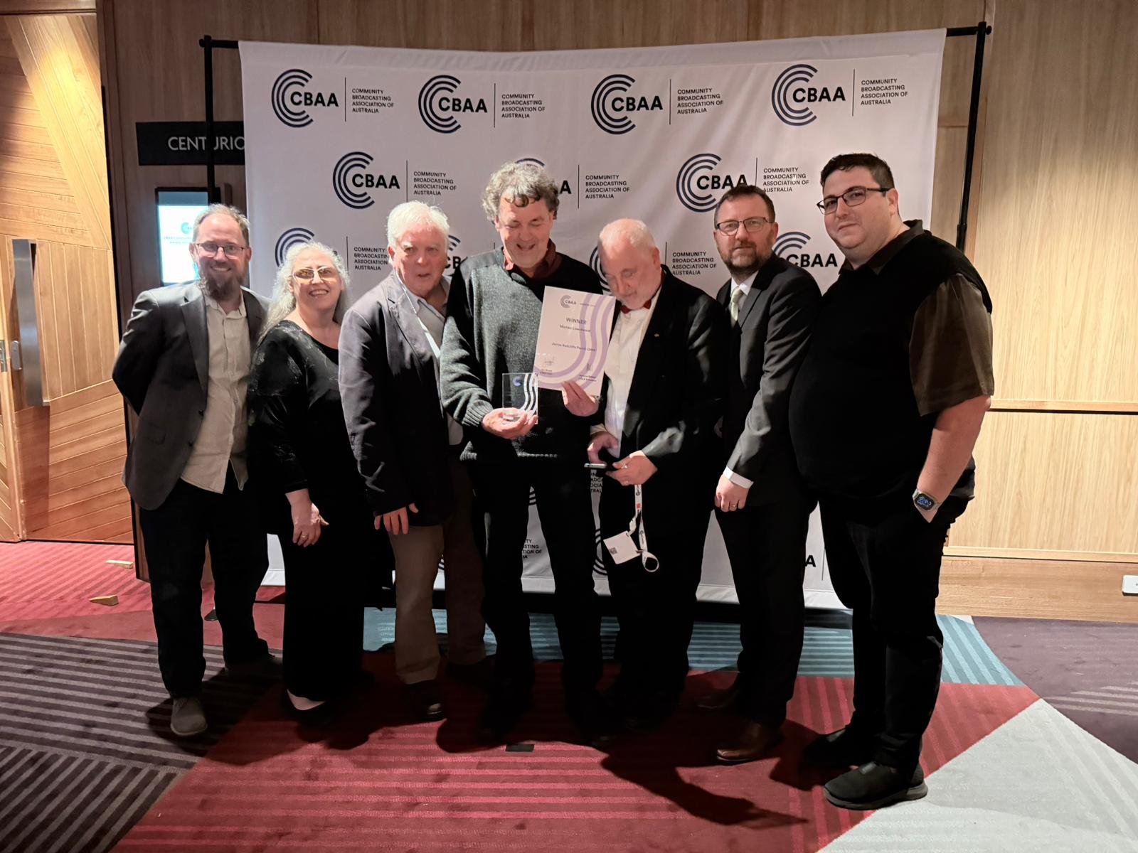 WhatsApp Image 2025 10 26 At 09.24.41 E5dede33 TR Comittee gathering around Award Winner Jim Parish